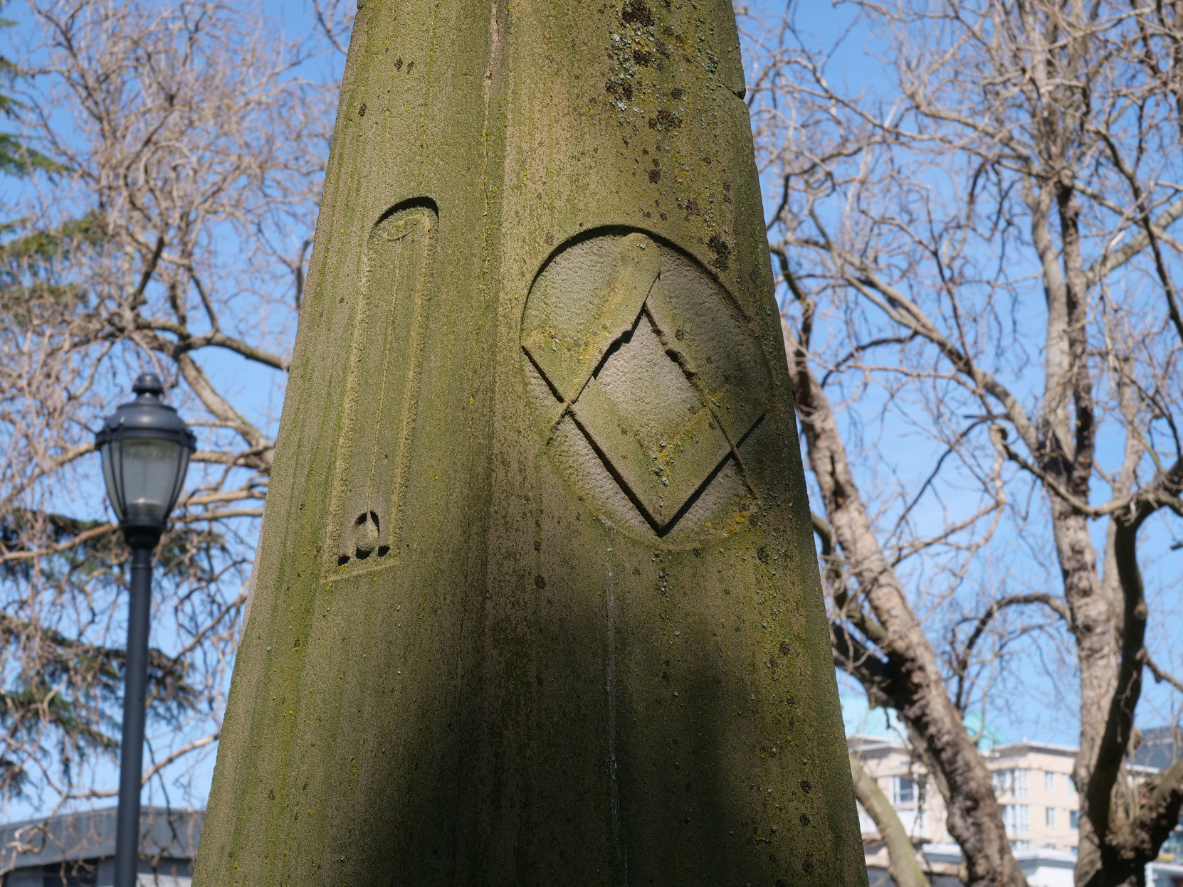 The Square & Compasses and the Plumb inscribed on the grave marker of Andrew Phillipps in Pioneer Square, Victoria, B.C. [photo: Vancouver & Quadra Lodge No. 2 Historian]