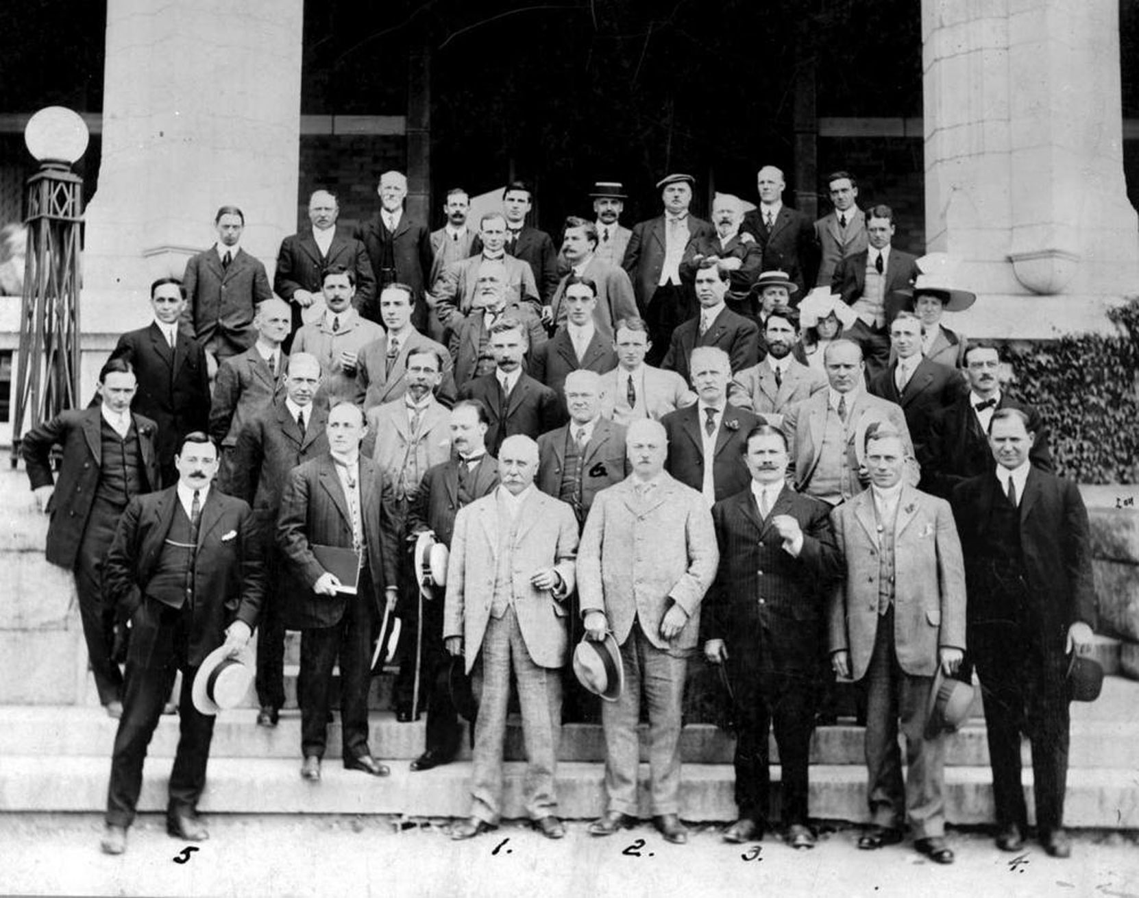 B.C. Architects Society at the Empress Hotel, Victoria, circa 1913. Harold Joseph Rous Cullin is on the left in the first row, holding the white hat. [BC Archives photo F-09372]