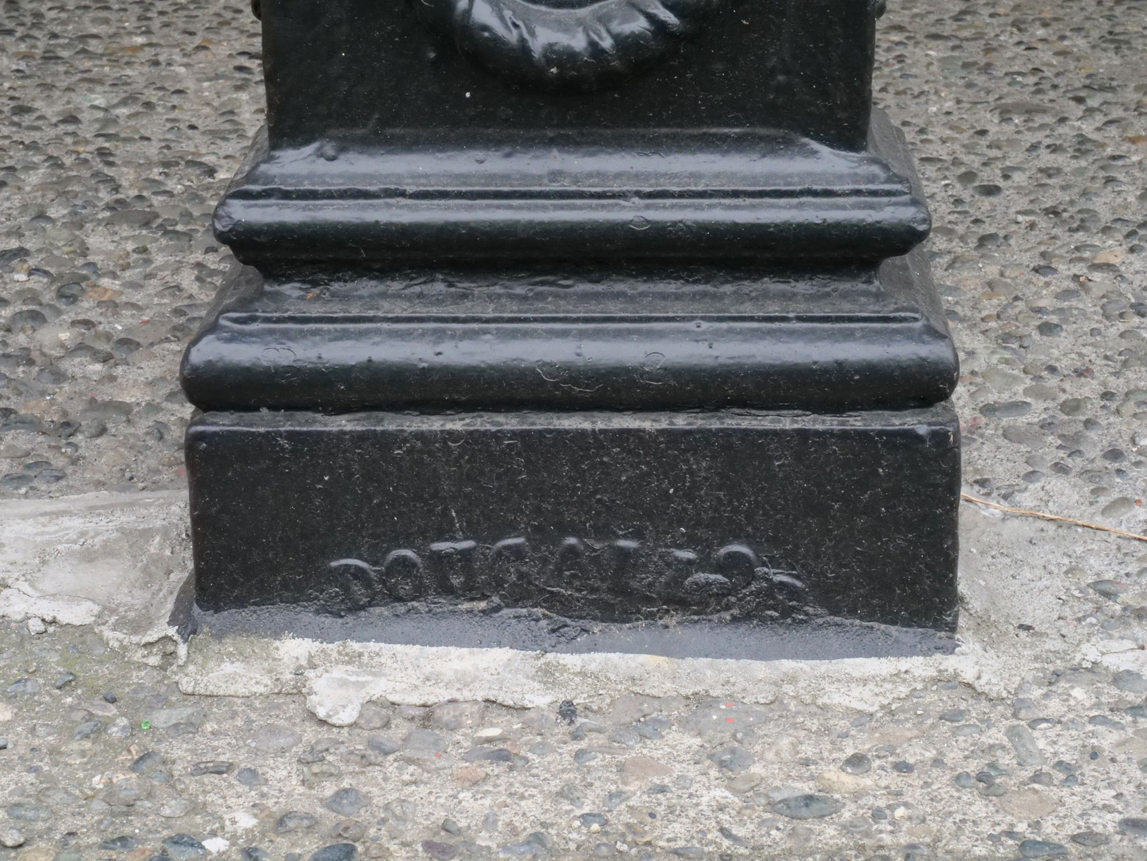 Base of an Iron support pillar at 1218 Wharf Street, manufactured in San Francisco circa 1860 and showing the manufacturer's name. [photo: Mark Anderson]